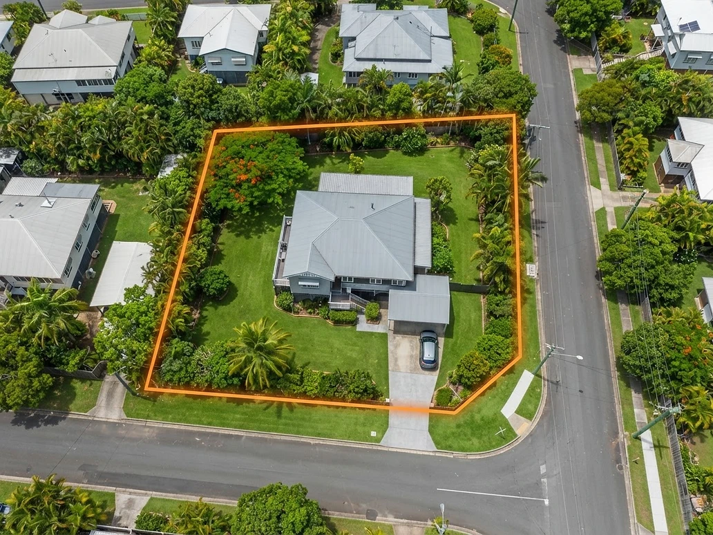 Aerial view of a Queensland residential block with the property boundary drawn in orange